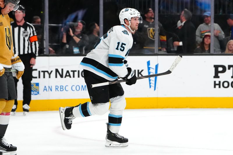 Nov 2, 2024; Las Vegas, Nevada, USA; Utah Hockey Club center Alexander Kerfoot (15) returns to the bench after scoring a goal against the Vegas Golden Knights during the third period at T-Mobile Arena. Mandatory Credit: Stephen R. Sylvanie-Imagn Images