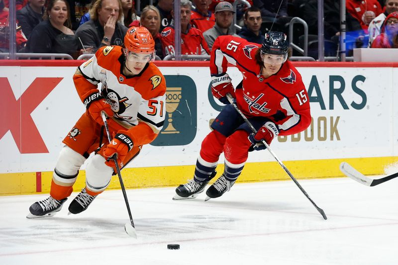 Jan 5, 2026; Washington, District of Columbia, USA; Anaheim Ducks defenseman Olen Zellweger (51) skates with the puck as Washington Capitals left wing Sonny Milano (15) chases during the first period at Capital One Arena. Mandatory Credit: Geoff Burke-Imagn Images