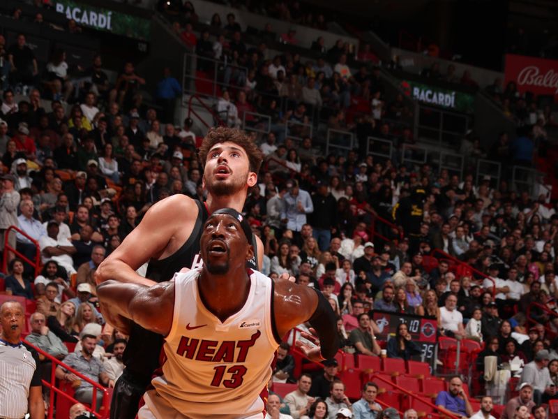 MIAMI, FL - JANUARY 8: Bam Adebayo #13 of the Miami Heat boxes out during the game against the Houston Rockets on January 8, 2024 at Kaseya Center in Miami, Florida. NOTE TO USER: User expressly acknowledges and agrees that, by downloading and or using this Photograph, user is consenting to the terms and conditions of the Getty Images License Agreement. Mandatory Copyright Notice: Copyright 2024 NBAE (Photo by Issac Baldizon/NBAE via Getty Images)