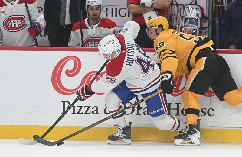 Dec 11, 2025; Pittsburgh, Pennsylvania, USA;  Montreal Canadiens defenseman Lane Hutson (48) and Pittsburgh Penguins center Noel Acciari (55) battle for the puck during the second period at PPG Paints Arena. Mandatory Credit: Philip G. Pavely-Imagn Images