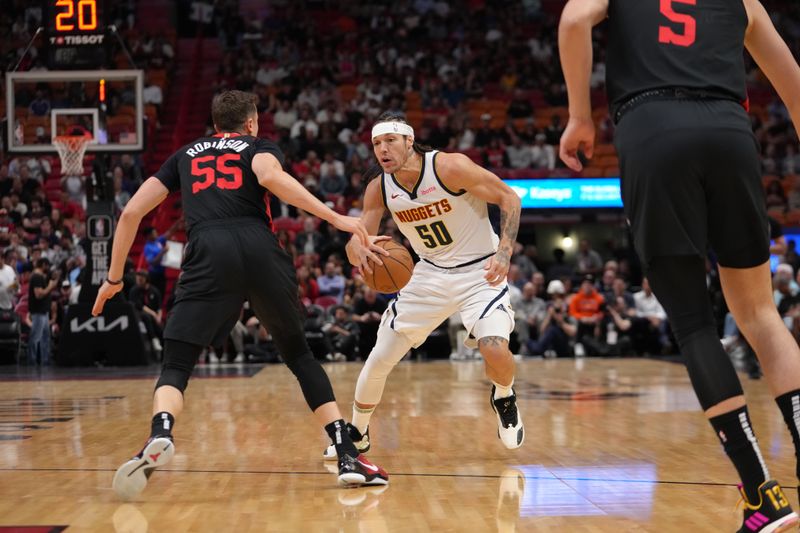 MIAMI, FL - MARCH 13: Aaron Gordon #50 of the Denver Nuggets dribbles the ball during the game against the Miami Heat on March 13, 2024 at Kaseya Center in Miami, Florida. NOTE TO USER: User expressly acknowledges and agrees that, by downloading and or using this Photograph, user is consenting to the terms and conditions of the Getty Images License Agreement. Mandatory Copyright Notice: Copyright 2024 NBAE (Photo by Eric Espada/NBAE via Getty Images)