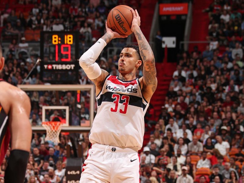 MIAMI, FL - MARCH 10: Kyle Kuzma #33 of the Washington Wizards three point basket during the game against the Miami Heat on March 10, 2024 at Kaseya Center in Miami, Florida. NOTE TO USER: User expressly acknowledges and agrees that, by downloading and or using this Photograph, user is consenting to the terms and conditions of the Getty Images License Agreement. Mandatory Copyright Notice: Copyright 2024 NBAE (Photo by Issac Baldizon/NBAE via Getty Images)