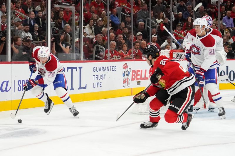 Oct 11, 2025; Chicago, Illinois, USA; Chicago Blackhawks center Sam Lafferty (24) defends Montréal Canadiens right wing Zack Bolduc (76) during the first period at United Center. Mandatory Credit: David Banks-Imagn Images