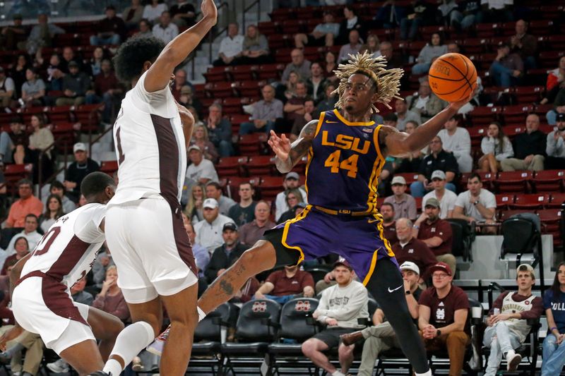 Feb 8, 2023; Starkville, Mississippi, USA; LSU Tigers guard Adam Miller (44) passes the ball as Mississippi State Bulldogs forward Tolu Smith (1) defends during the second half at Humphrey Coliseum. Mandatory Credit: Petre Thomas-USA TODAY Sports