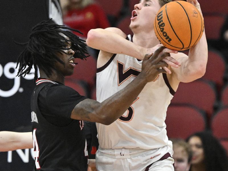 Mar 5, 2024; Louisville, Kentucky, USA; Louisville Cardinals guard Ty-Laur Johnson (4) fouls Virginia Tech Hokies guard Sean Pedulla (3) during the second half at KFC Yum! Center. Virginia Tech defeated Louisville 80-64. Mandatory Credit: Jamie Rhodes-USA TODAY Sports