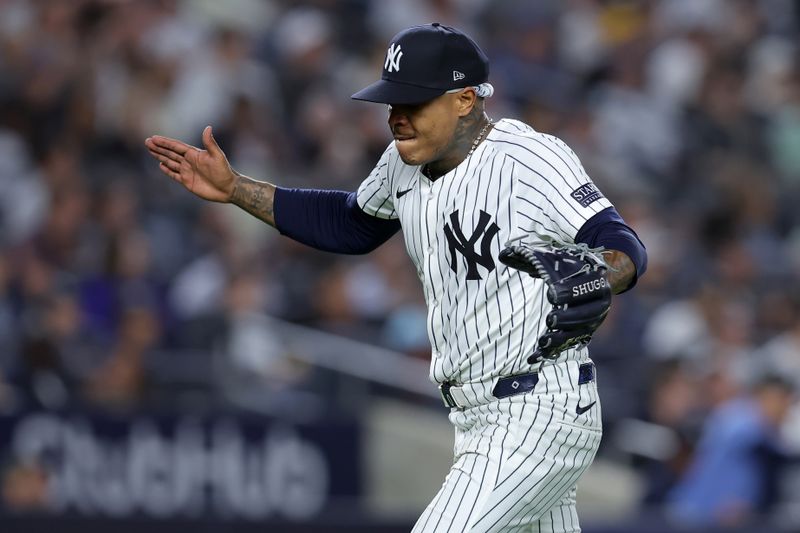 May 20, 2024; Bronx, New York, USA; New York Yankees starting pitcher Marcus Stroman (0) reacts during the seventh inning against the Seattle Mariners at Yankee Stadium. Mandatory Credit: Brad Penner-USA TODAY Sports