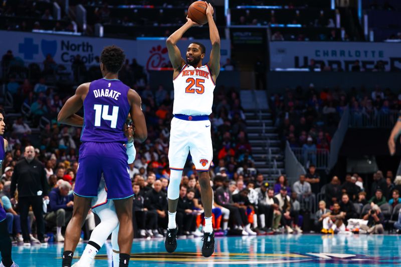 CHARLOTTE, NORTH CAROLINA - NOVEMBER 29: Mikal Bridges #25 of the New York Knicks shoots the ball over Moussa Diabate #14 of the Charlotte Hornets during the second half of a basketball game at Spectrum Center on November 29, 2024 in Charlotte, North Carolina. NOTE TO USER: User expressly acknowledges and agrees that, by downloading and or using this photograph, User is consenting to the terms and conditions of the Getty Images License Agreement. (Photo by David Jensen/Getty Images)