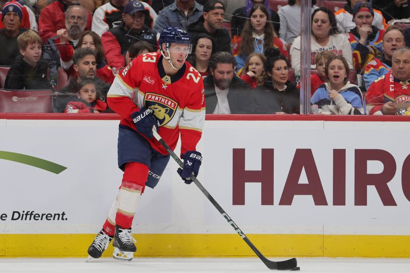 Feb 6, 2024; Sunrise, Florida, USA; Florida Panthers center Carter Verhaeghe (23) moves the puck against the Philadelphia Flyers during the first period at Amerant Bank Arena. Mandatory Credit: Sam Navarro-USA TODAY Sports