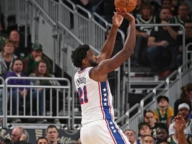 MILWAUKEE, WI - OCTOBER 26: Joel Embiid #21 of the Philadelphia 76ers shoots the ball during the game against the Milwaukee Bucks on October 26, 2023 at the Fiserv Forum Center in Milwaukee, Wisconsin. NOTE TO USER: User expressly acknowledges and agrees that, by downloading and or using this Photograph, user is consenting to the terms and conditions of the Getty Images License Agreement. Mandatory Copyright Notice: Copyright 2023 NBAE (Photo by Gary Dineen/NBAE via Getty Images).