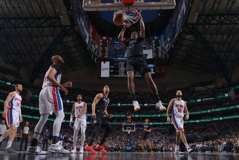 DALLAS, TX - APRIL 12: Olivier Maxence-Prosper #18 of the Dallas Mavericks dunks the ball during the game against the Detroit Pistons on April 12, 2024 at the American Airlines Center in Dallas, Texas. NOTE TO USER: User expressly acknowledges and agrees that, by downloading and or using this photograph, User is consenting to the terms and conditions of the Getty Images License Agreement. Mandatory Copyright Notice: Copyright 2024 NBAE (Photo by Glenn James/NBAE via Getty Images)