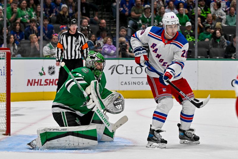 Nov 20, 2023; Dallas, Texas, USA; New York Rangers left wing Chris Kreider (20) attempts to redirect the puck past Dallas Stars goaltender Scott Wedgewood (41) during the third period at the American Airlines Center. Mandatory Credit: Jerome Miron-USA TODAY Sports