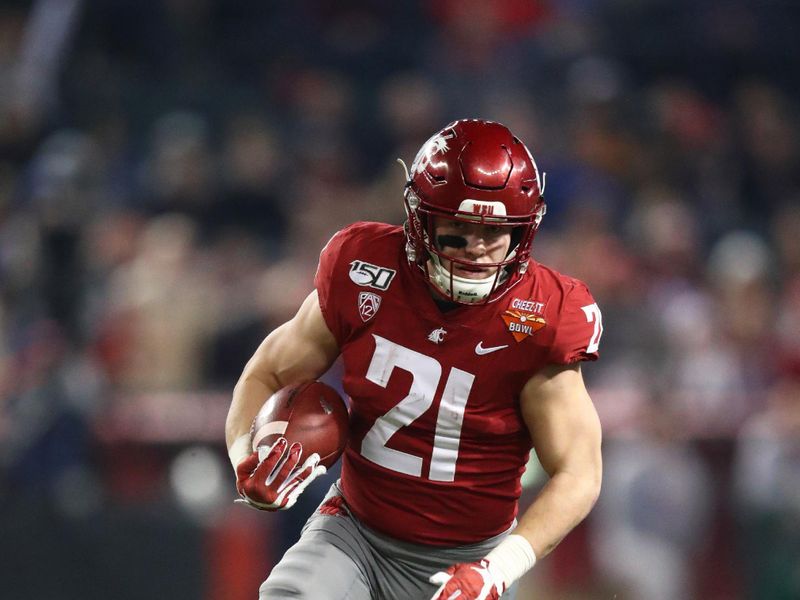 Dec 27, 2019; Phoenix, Arizona, USA; Washington State Cougars running back Max Borghi (21) against the Air Force Falcons during the first half of the Cheez-It Bowl at Chase Field. Mandatory Credit: Mark J. Rebilas-USA TODAY Sports