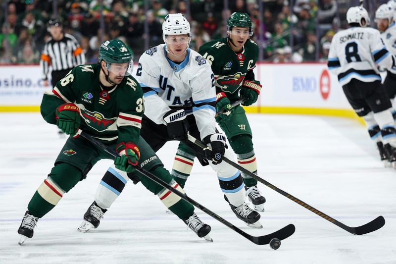 Jan 23, 2025; Saint Paul, Minnesota, USA; Utah Hockey Club defenseman Olli Maatta (2) and Minnesota Wild right wing Mats Zuccarello (36) compete for the puck during the third period at Xcel Energy Center. Mandatory Credit: Matt Krohn-Imagn Images