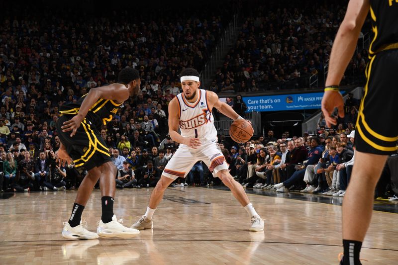 SAN FRANCISCO, CA - FEBRUARY 10: Devin Booker #1 of the Phoenix Suns dribbles the ball during the game against the Golden State Warriors on February 10, 2024 at Chase Center in San Francisco, California. NOTE TO USER: User expressly acknowledges and agrees that, by downloading and or using this photograph, user is consenting to the terms and conditions of Getty Images License Agreement. Mandatory Copyright Notice: Copyright 2024 NBAE (Photo by Noah Graham/NBAE via Getty Images)