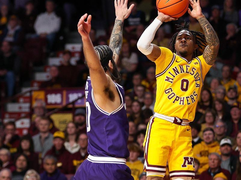 Feb 3, 2024; Minneapolis, Minnesota, USA; Minnesota Golden Gophers guard Elijah Hawkins (0) shoots as Northwestern Wildcats guard Boo Buie (0) defends during the first half at Williams Arena. Mandatory Credit: Matt Krohn-USA TODAY Sports