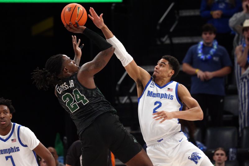 Feb 11, 2024; Memphis, Tennessee, USA; Tulane Green Wave forward Kevin Cross (24) shoots as Memphis Tigers forward Nicholas Jourdain (2) during the first half at FedExForum. Mandatory Credit: Petre Thomas-USA TODAY Sports