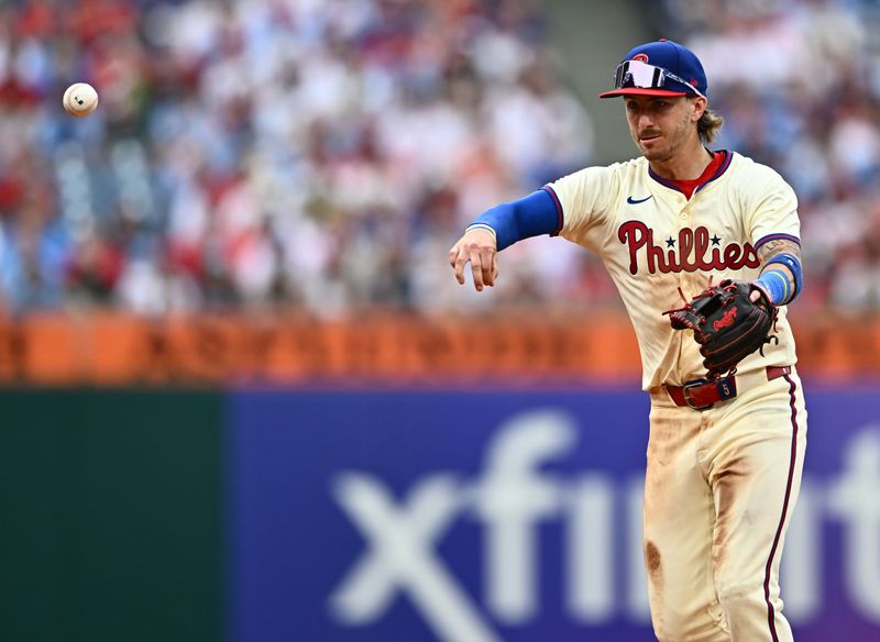 Jun 5, 2024; Philadelphia, Pennsylvania, USA; Philadelphia Phillies second baseman Bryson Stott (5) throws to first base against the Milwaukee Brewers in the seventh inning at Citizens Bank Park. Mandatory Credit: Kyle Ross-USA TODAY Sports