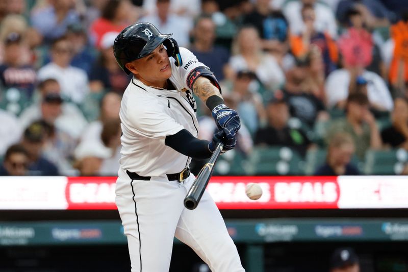 Jun 12, 2024; Detroit, Michigan, USA; Detroit Tigers third baseman Gio Urshela (13) hits a single in the fourth inning against the Washington Nationals at Comerica Park. Mandatory Credit: Rick Osentoski-USA TODAY Sports