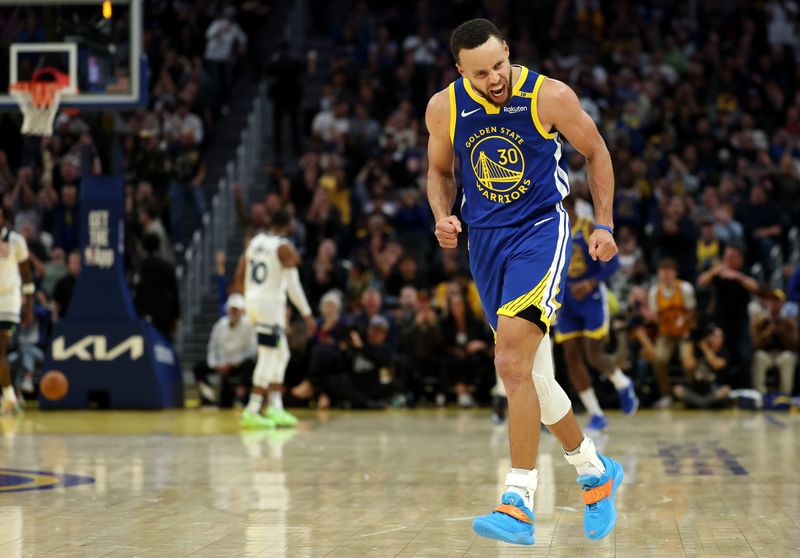 SAN FRANCISCO, CALIFORNIA - DECEMBER 06: Stephen Curry #30 of the Golden State Warriors reacts after making a basket against the Minnesota Timberwolves during the second half at Chase Center on December 06, 2024 in San Francisco, California. NOTE TO USER: User expressly acknowledges and agrees that, by downloading and/or using this photograph, user is consenting to the terms and conditions of the Getty Images License Agreement.   (Photo by Ezra Shaw/Getty Images)