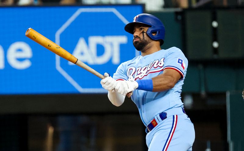 Jul 23, 2023; Arlington, Texas, USA;  Texas Rangers shortstop Ezequiel Duran (20) hits an rbi double during the fourth inning against the Los Angeles Dodgers at Globe Life Field. Mandatory Credit: Kevin Jairaj-USA TODAY Sports