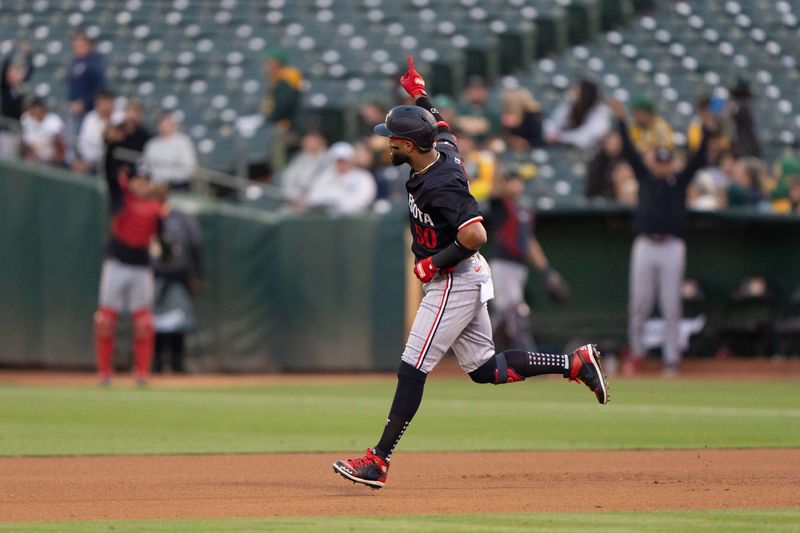 Jun 21, 2024; Oakland, California, USA; Minnesota Twins shortstop Willi Castro (50) reacts after hitting a three run home run against the Oakland Athletics during the seventh inning at Oakland-Alameda County Coliseum. Mandatory Credit: Stan Szeto-USA TODAY Sports