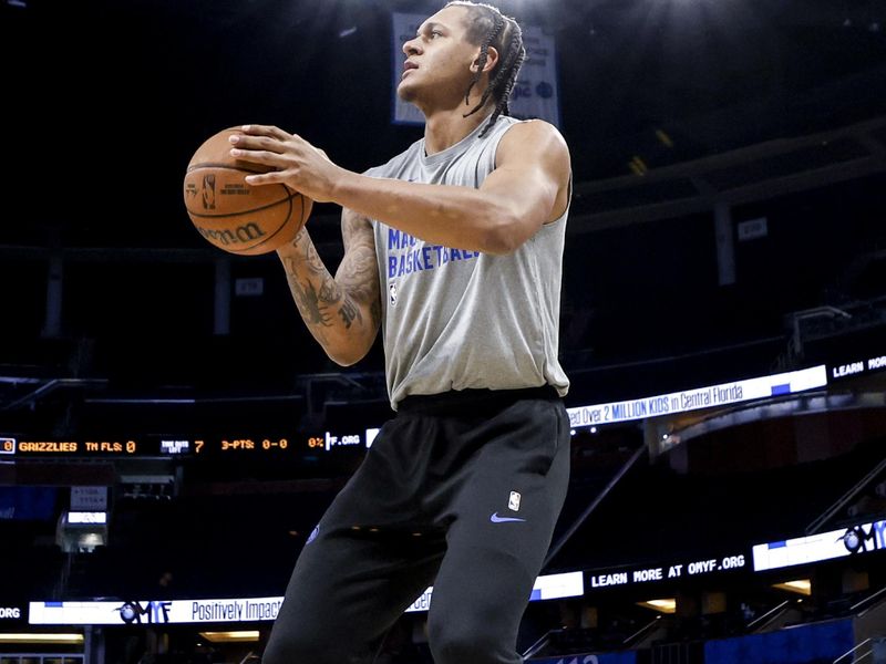 ORLANDO, FL - MARCH 30: Paolo Banchero #5 of the Orlando Magic warms up prior to the start of the game against the Memphis Grizzlies at the Kia Center on March 30, 2024 in Orlando, Florida. NOTE TO USER: User expressly acknowledges and agrees that, by downloading and or using this photograph, User is consenting to the terms and conditions of the Getty Images License Agreement. (Photo by Don Juan Moore/Getty Images)