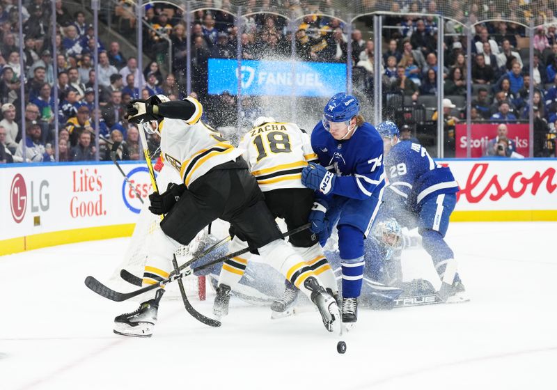 Nov 5, 2024; Toronto, Ontario, CAN; Boston Bruins center Pavel Zacha (18) battles with Toronto Maple Leafs center Bobby McMann (74) in front of goaltender Anthony Stolarz (41) during the second period at Scotiabank Arena. Mandatory Credit: Nick Turchiaro-Imagn Imagess