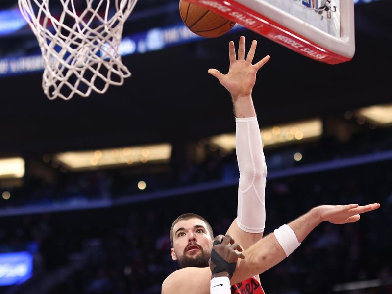 INGLEWOOD, CALIFORNIA - DECEMBER 03: Ivica Zubac #40 of the LA Clippers shoots as Deandre Ayton #2 of the Portland Trail Blazers defends in the second quarter of an Emirates NBA Cup game at Intuit Dome on December 03, 2024 in Inglewood, California. NOTE TO USER: User expressly acknowledges and agrees that, by downloading and or using this photograph, User is consenting to the terms and conditions of the Getty Images License Agreement. (Photo by Katelyn Mulcahy/Getty Images)