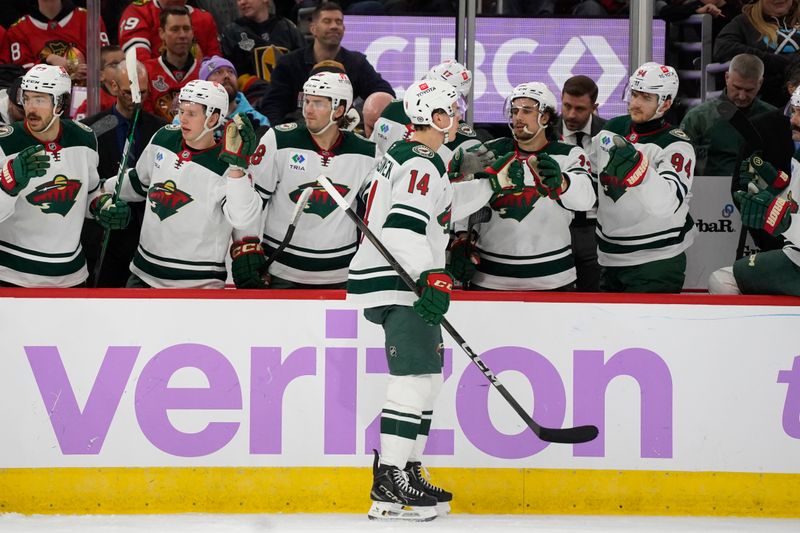 Jan 26, 2025; Chicago, Illinois, USA; Minnesota Wild center Joel Eriksson Ek (14) celebrates his goal against the Chicago Blackhawks during the second period at United Center. Mandatory Credit: David Banks-Imagn Images