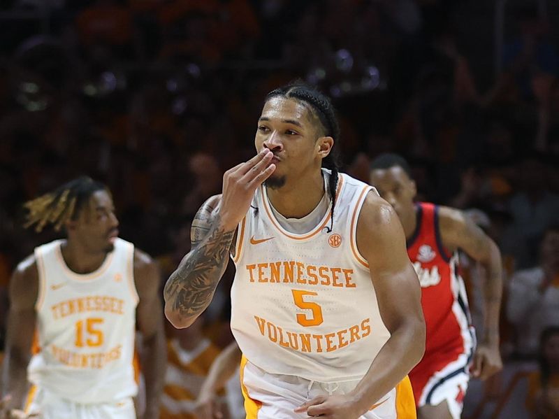Jan 6, 2024; Knoxville, Tennessee, USA; Tennessee Volunteers guard Zakai Zeigler (5) reacts after shooting a three pointer against the Mississippi Rebels during the second half at Thompson-Boling Arena at Food City Center. Mandatory Credit: Randy Sartin-USA TODAY Sports