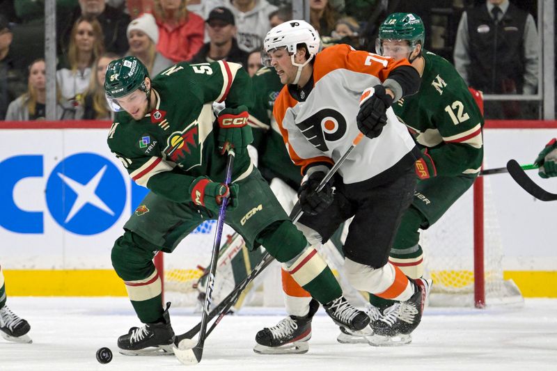 Jan 12, 2024; Saint Paul, Minnesota, USA; Minnesota Wild forward Adam Raska (51) and Philadelphia Flyers forward Tyson Foerster (71) battle for the puck during the second period at Xcel Energy Center. Mandatory Credit: Nick Wosika-USA TODAY Sports