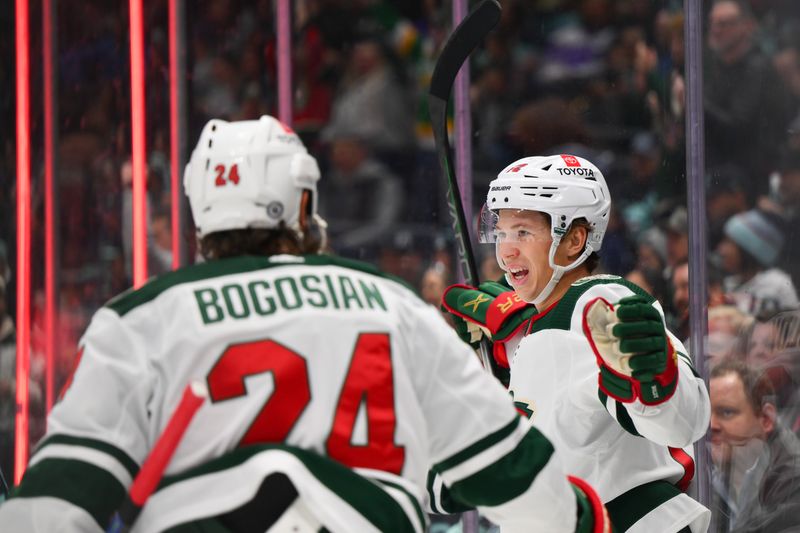 Dec 10, 2023; Seattle, Washington, USA; Minnesota Wild left wing Matt Boldy (12) celebrates after scoring a goal against the Seattle Kraken during the first period at Climate Pledge Arena. Mandatory Credit: Steven Bisig-USA TODAY Sports