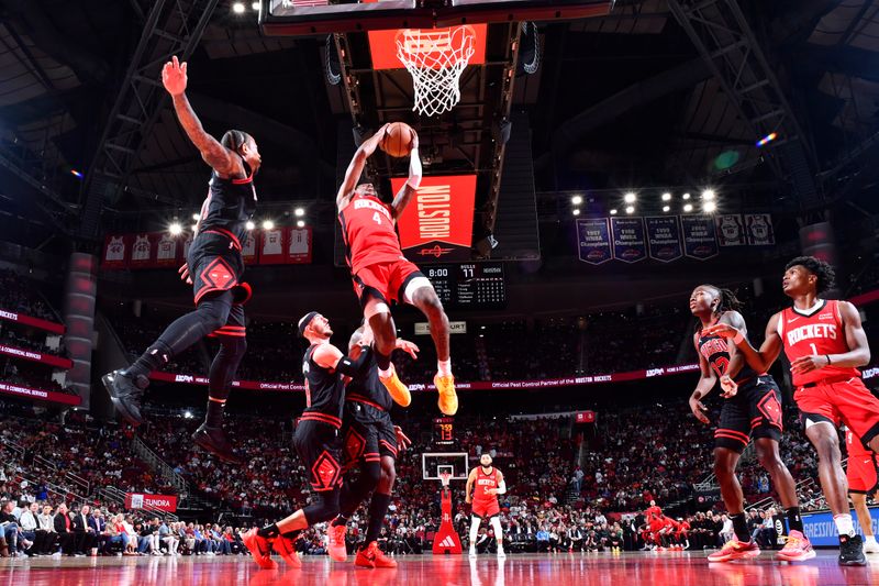 HOUSTON, TX - MARCH 21:   Jalen Green #4 of the Houston Rockets drives to the basket during the game against the Chicago Bulls on March 21, 2024 at the Toyota Center in Houston, Texas. NOTE TO USER: User expressly acknowledges and agrees that, by downloading and or using this photograph, User is consenting to the terms and conditions of the Getty Images License Agreement. Mandatory Copyright Notice: Copyright 2024 NBAE (Photo by Logan Riely/NBAE via Getty Images)