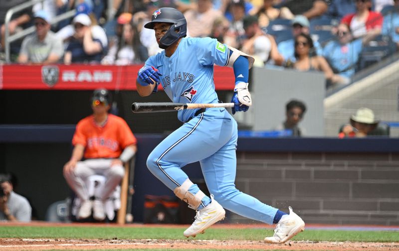 Jul 4, 2024; Toronto, Ontario, CAN; Toronto Blue Jays shortstop Leo Jiminez (49) bats against the Houston Astros in the fifth inning at Rogers Centre. Mandatory Credit: Dan Hamilton-USA TODAY Sports