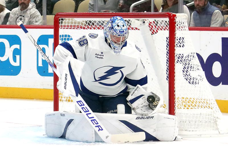 Nov 19, 2024; Pittsburgh, Pennsylvania, USA; Tampa Bay Lightning goaltender Andrei Vasilevskiy (88) makes a glove save against the Pittsburgh Penguins during the first period at PPG Paints Arena. Mandatory Credit: Charles LeClaire-Imagn Images