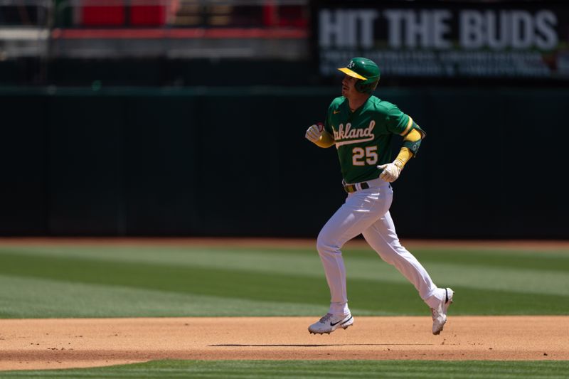 Apr 30, 2023; Oakland, California, USA;  Oakland Athletics left fielder Brent Rooker (25) jogs towards second base after hitting a solo home run during the fourth inning against the Cincinnati Reds at RingCentral Coliseum. Mandatory Credit: Stan Szeto-USA TODAY Sports