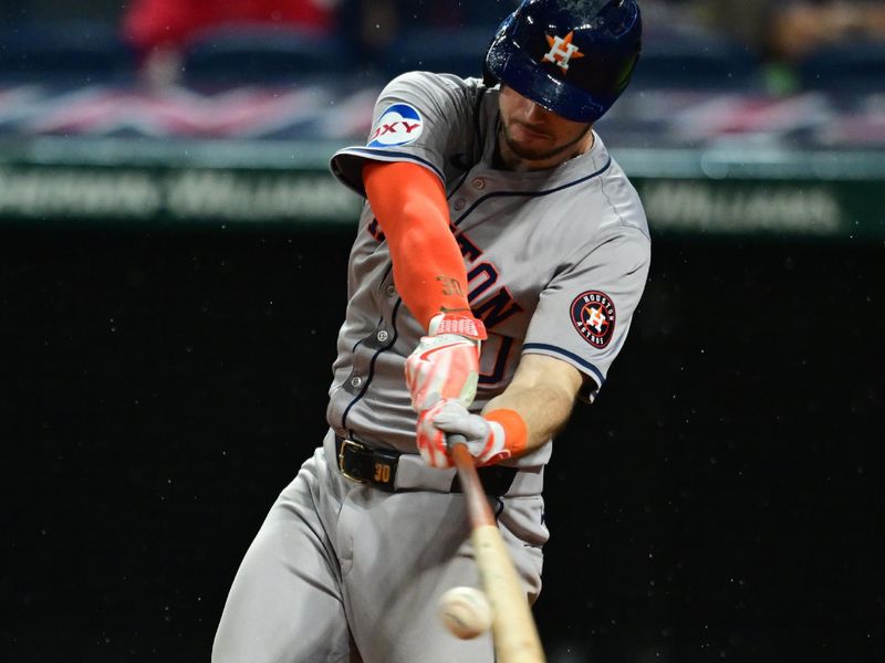 Sep 27, 2024; Cleveland, Ohio, USA; Houston Astros right fielder Kyle Tucker (30) hits a single during the eighth inning against the Cleveland Guardians at Progressive Field. Mandatory Credit: Ken Blaze-Imagn Images