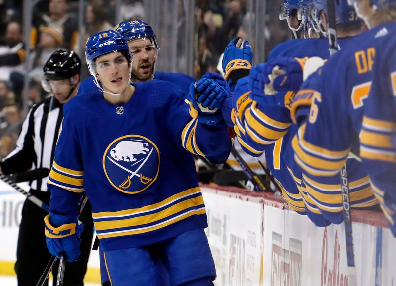 Dec 10, 2022; Pittsburgh, Pennsylvania, USA; Buffalo Sabres center Peyton Krebs (left) celebrates with the Buffalo bench after scoring a goal against the Pittsburgh Penguins during the third period at PPG Paints Arena. The Penguins won 3-1. Mandatory Credit: Charles LeClaire-USA TODAY Sports