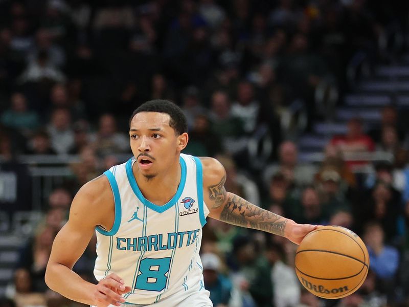 MILWAUKEE, WISCONSIN - FEBRUARY 09: Nick Smith Jr. #8 of the Charlotte Hornets handles the ball during a game against the Milwaukee Bucks at Fiserv Forum on February 09, 2024 in Milwaukee, Wisconsin. NOTE TO USER: User expressly acknowledges and agrees that, by downloading and or using this photograph, User is consenting to the terms and conditions of the Getty Images License Agreement. (Photo by Stacy Revere/Getty Images)