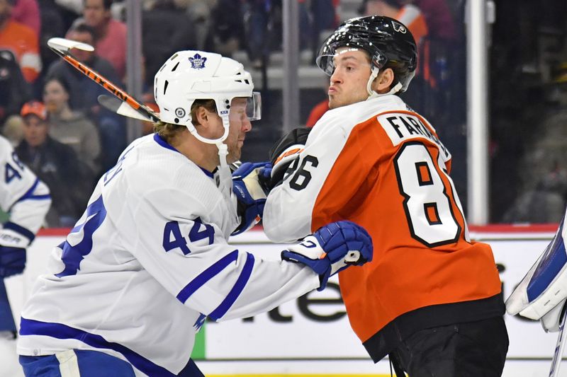 Mar 14, 2024; Philadelphia, Pennsylvania, USA; Toronto Maple Leafs defenseman Morgan Rielly (44) and Philadelphia Flyers left wing Joel Farabee (86) battle for position during the first period at Wells Fargo Center. Mandatory Credit: Eric Hartline-USA TODAY Sports