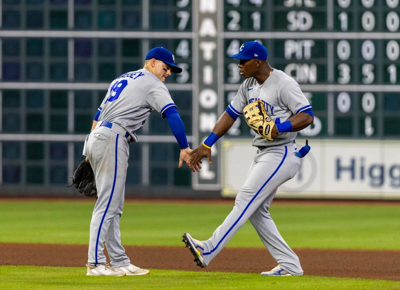 Sep 23, 2023; Houston, Texas, USA; Kansas City Royals second baseman Michael Massey (19) and  left fielder Dairon Blanco (44) celebrate after defeating the Houston Astros at Minute Maid Park. Mandatory Credit: Thomas Shea-USA TODAY Sports