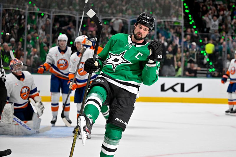 Oct 12, 2024; Dallas, Texas, USA; Dallas Stars left wing Jamie Benn (14) celebrates after he scores a goal against the New York Islanders during the second period at the American Airlines Center. Mandatory Credit: Jerome Miron-Imagn Images