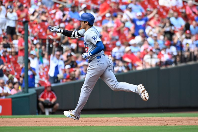 Aug 18, 2024; St. Louis, Missouri, USA; Los Angeles Dodgers designated hitter Shohei Ohtani (17) rounds the bases after hitting a solo home run against the St. Louis Cardinals in the fifth inning at Busch Stadium. Mandatory Credit: Joe Puetz-USA TODAY Sports