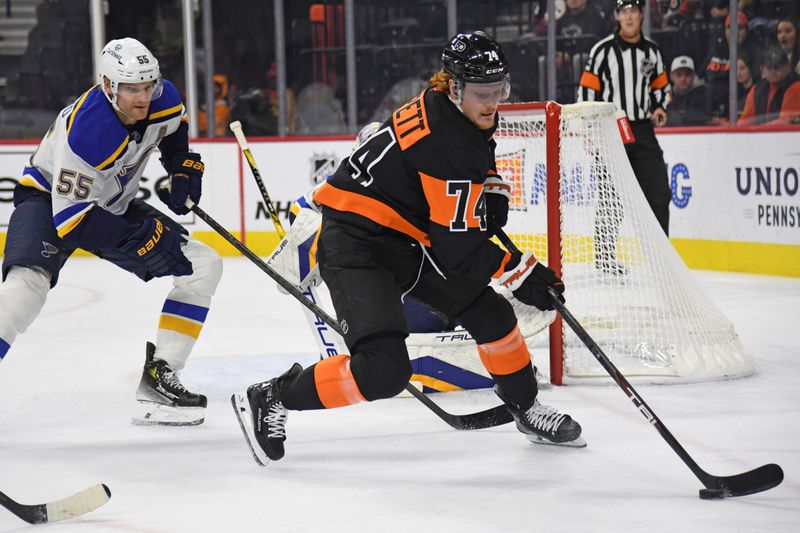 Oct 31, 2024; Philadelphia, Pennsylvania, USA; Philadelphia Flyers right wing Owen Tippett (74) controls the puck against St. Louis Blues defenseman Colton Parayko (55) during the first period at Wells Fargo Center. Mandatory Credit: Eric Hartline-Imagn Images