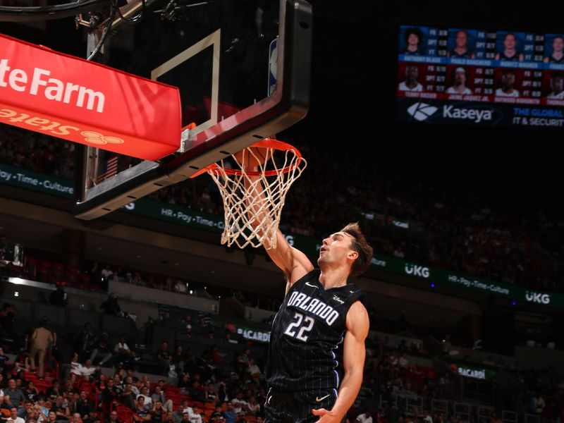 MIAMI, FL - OCTOBER 23: Franz Wagner #22 of the Orlando Magic dunks the ball during the game against the Miami Heat on October 23, 2024 at Kaseya Center in Miami, Florida. NOTE TO USER: User expressly acknowledges and agrees that, by downloading and or using this Photograph, user is consenting to the terms and conditions of the Getty Images License Agreement. Mandatory Copyright Notice: Copyright 2024 NBAE (Photo by Issac Baldizon/NBAE via Getty Images)