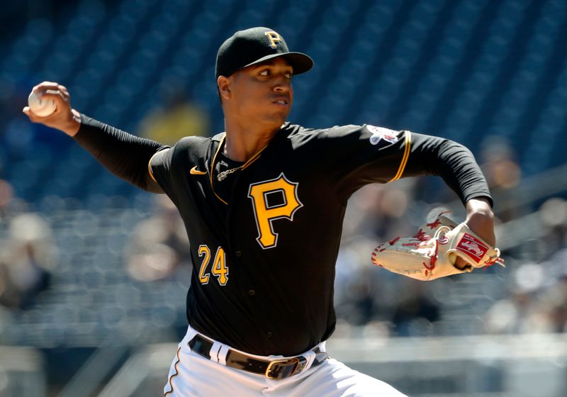 Apr 9, 2023; Pittsburgh, Pennsylvania, USA;  Pittsburgh Pirates relief pitcher Johan Oviedo (24) delivers a pitch against the Chicago White Sox during the first inning at PNC Park. Mandatory Credit: Charles LeClaire-USA TODAY Sports