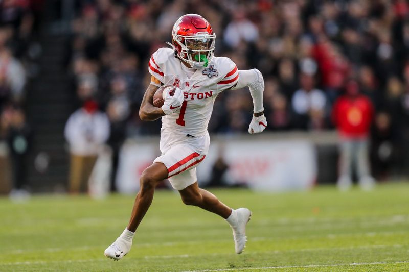 Dec 4, 2021; Cincinnati, Ohio, USA; Houston Cougars wide receiver Nathaniel Dell (1) runs with the ball against the Cincinnati Bearcats in the first half during the American Athletic Conference championship game at Nippert Stadium. Mandatory Credit: Katie Stratman-USA TODAY Sports