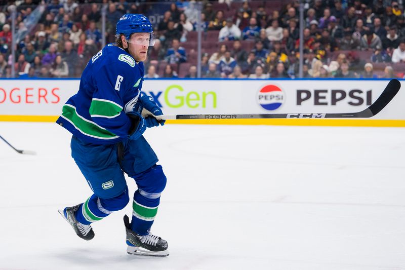 Feb 27, 2024; Vancouver, British Columbia, CAN; Vancouver Canucks forward Brock Boeser (6) sktates against the Pittsburgh Penguins in the third period at Rogers Arena. Penguins won 4-3 in overtime. Mandatory Credit: Bob Frid-USA TODAY Sports