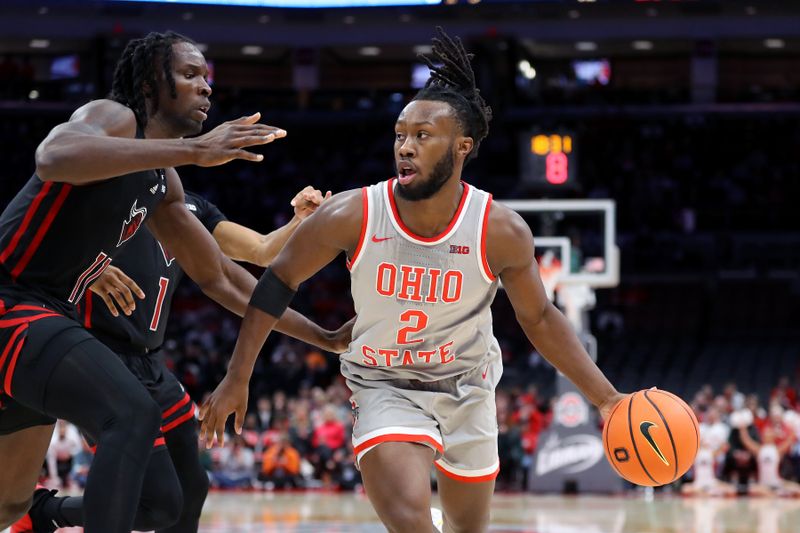 Jan 3, 2024; Columbus, Ohio, USA; Ohio State Buckeyes guard Bruce Thornton (2) dribbles the ball as Rutgers Scarlet Knights center Clifford Omoruyi (11) defends during the second half at Value City Arena. Mandatory Credit: Joseph Maiorana-USA TODAY Sports