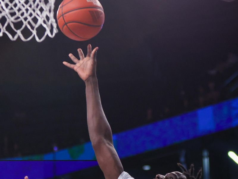 Jan 4, 2025; Atlanta, Georgia, USA; Georgia Tech Yellow Jackets forward Baye Ndongo (11) shoots against the Boston College Eagles in the second half at McCamish Pavilion. Mandatory Credit: Brett Davis-Imagn Images